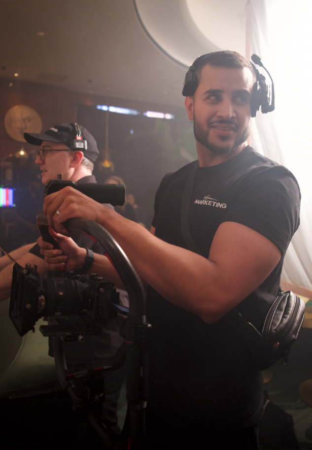 Romeo Chuffe on set, operating a cinema camera rig
